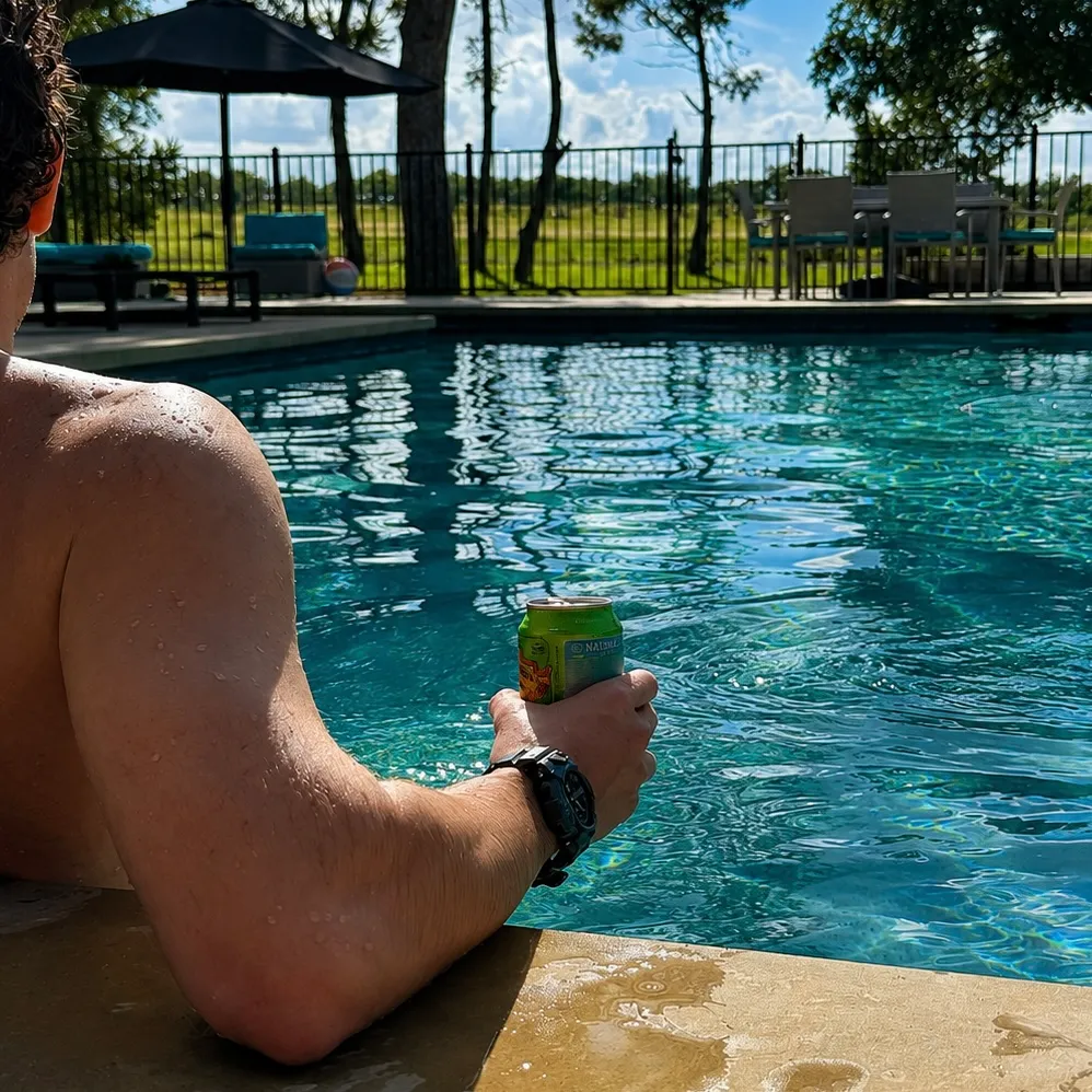Social by Marly sample post: person lounging poolside with a canned drink