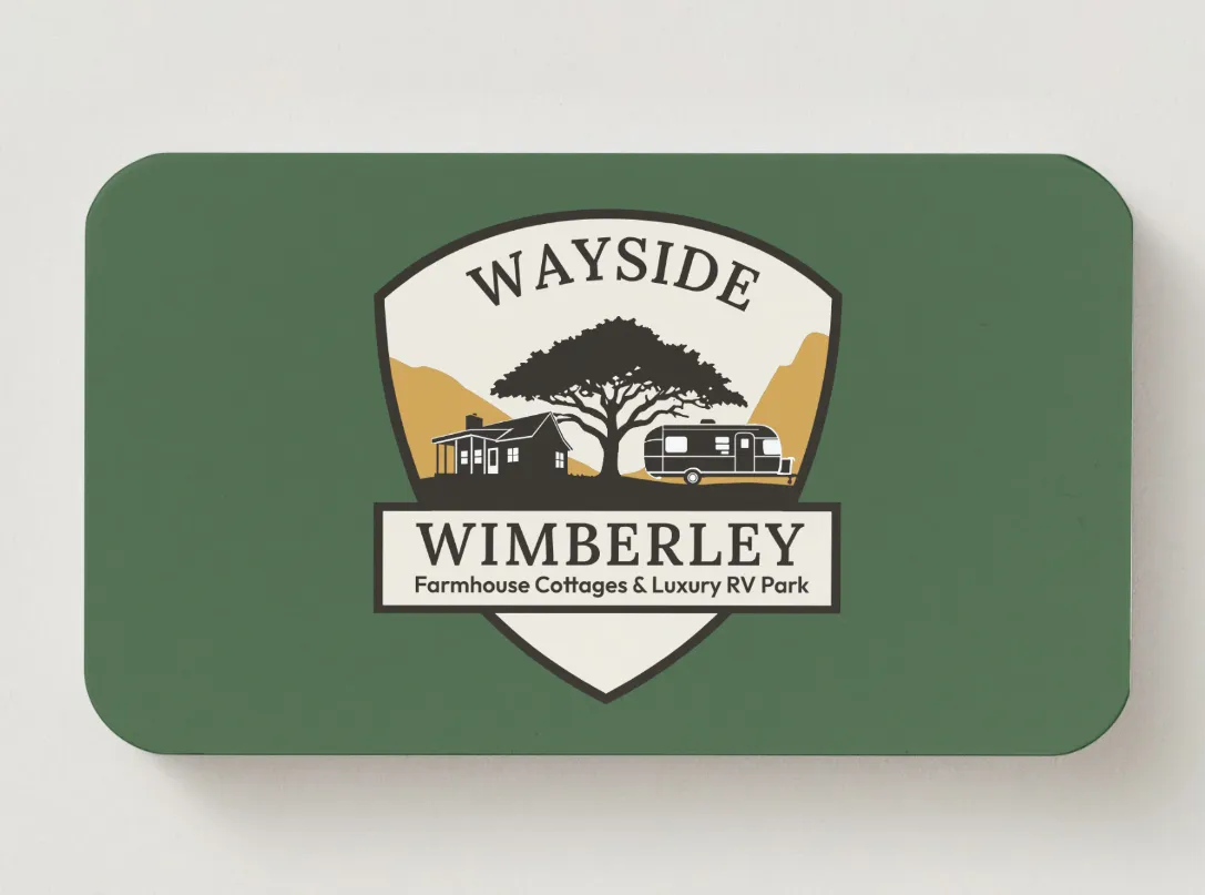 Wayside Wimberley logo featuring a tree, cottage, and RV on a green business card design